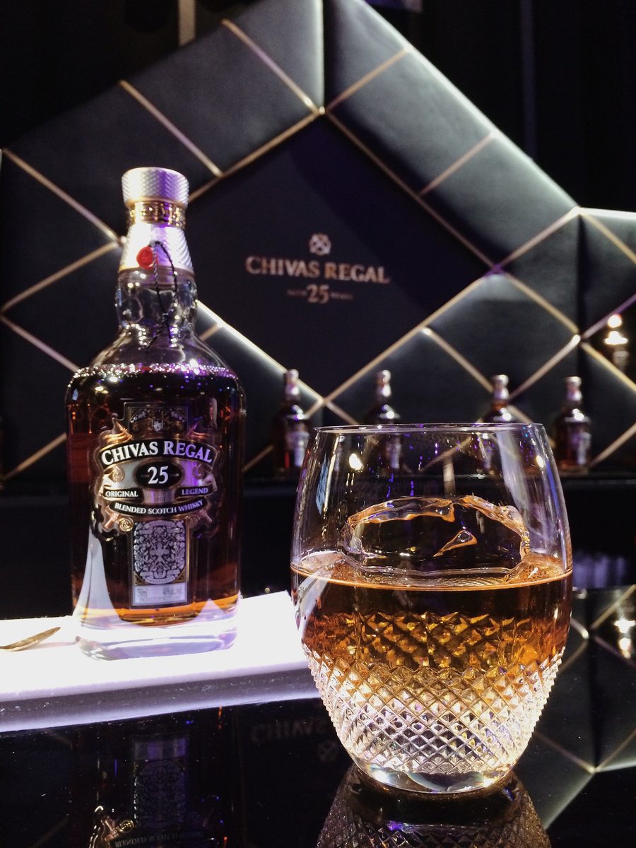 Chivas Regal 25 bottle and glass — moody product photography