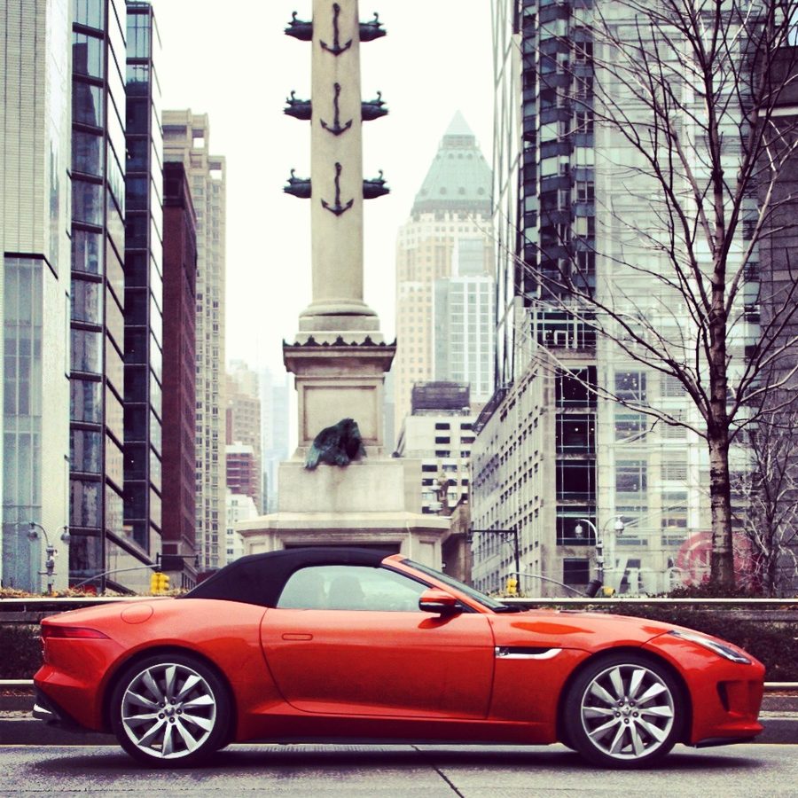 Red Jaguar F-Type convertible on a New York City street — automotive brand photography